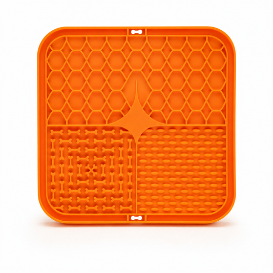 Orange silicone dog lick mat with textured grooves