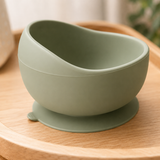 Close-up of the suction bowl's strong silicone base gripping a wooden highchair tray