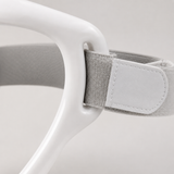 Close-up of the neck support brace white frame and grey velcro strap