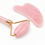 Close-up of the pink jade facial roller and gua sha stone