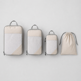 Set of three packing cubes in three sizes plus a matching drawstring laundry bag