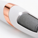 Macro of the callus remover grinding roller, rose-gold accent band and LED light