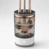 Makeup brushes spinning clean in soapy water inside the cleaner
