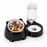 Black 2-in-1 cat-shaped pet feeding station with tilted food bowl and auto water dispenser