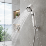 High-pressure filtered shower head mounted and spraying in a luxury stone walk-in shower