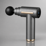 Mini massage gun in grey gunmetal colorway with gold accents