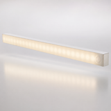 Slim white motion-sensor LED light bar glowing warm white