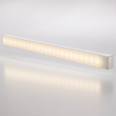 Slim white motion-sensor LED light bar glowing warm white