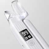 Close-up of the pet nail grinder's glowing LED guard cover and digital battery display