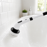 Cordless spin scrubber cleaning a white bathtub in a bright modern bathroom