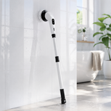Cordless power spin scrubber cleaning bright white bathroom wall tiles