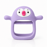 Silicone baby teether in purple, pig-face wrist-grip design on white background