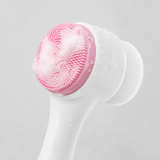 Facial cleansing brush with cleanser foam on the silicone side