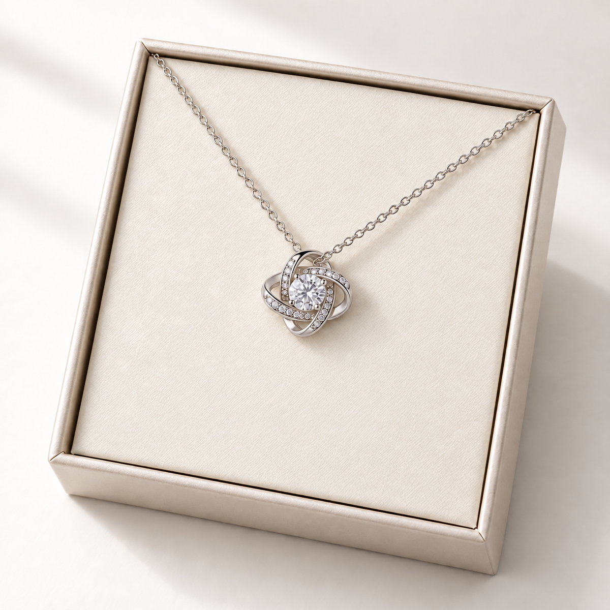 Love Knot necklace in its gift box, shown without message artwork
